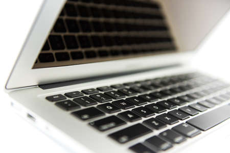 Laptop isolated on white background - macro wallpapersの写真素材