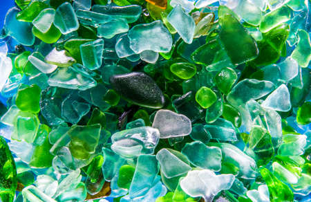 broken glass rolled with water backgroundの写真素材