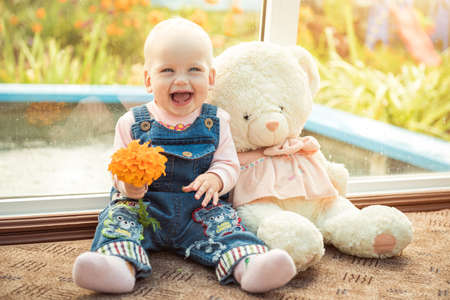 baby and teddy bear friendsの写真素材