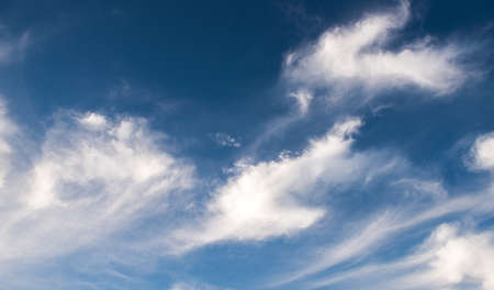 Blue sky background with cloudsの写真素材