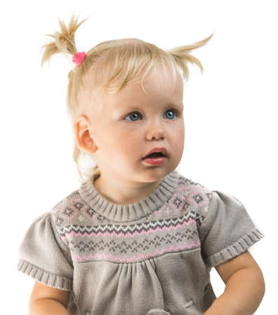 baby girl toddler looking straight isolatedの写真素材