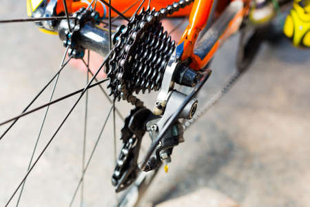 The system gear on the rear black wheel and chain tension on the professional sports bicycle.の写真素材