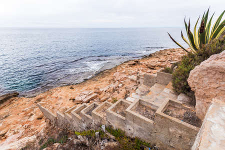 Spain coast, broken stairs  to sea waterの写真素材