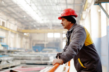 Kyiv, Ukraine - January 27, 2016: Old factory for concrete production. The staff and workers of the old workshop of concrete production. Technological processes of concrete productionのeditorial素材