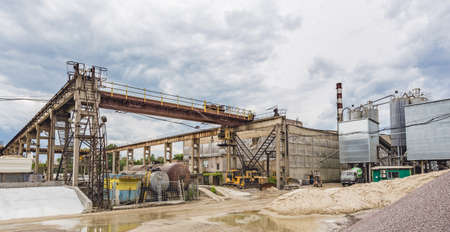 KIEV, UKRAINE - MAY 20, 2016: Old factory for concrete production. The staff and machines of the old workshop of concrete production. Technological processes of concrete productionのeditorial素材