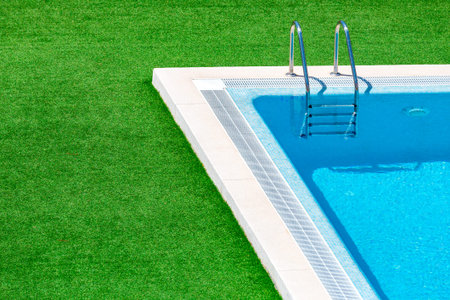 Swimming pool with stair in hotel pool resort.Swimming pool with blue spa swimming pool with clean...