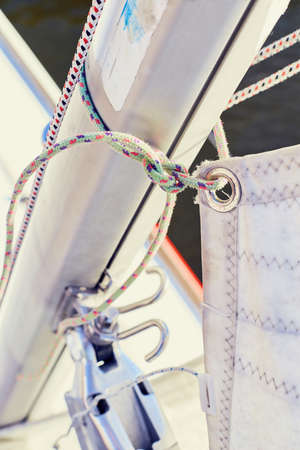 Wrong fixing the mainsail to the mast using the sheetsの写真素材