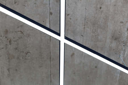 Ceiling in the loft style. Grey ceiling with fashionable energy-efficient line lightingの写真素材