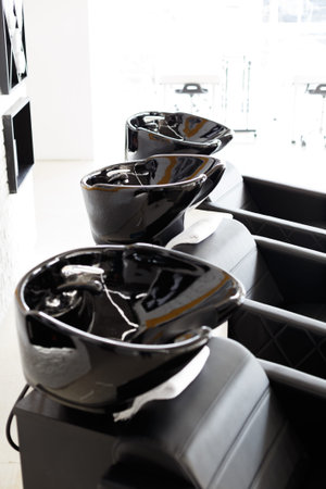 Black washbasin for hairdressers in beauty salonの写真素材