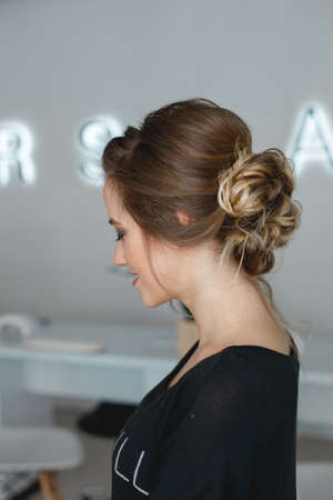 Kyiv, Ukraine - March 3, 2017: Profile of the model with a professional bride hair style. Preparation for the wedding in the morning in the salon.のeditorial素材