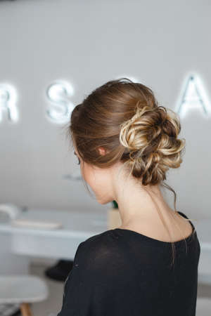 Kyiv, Ukraine - March 3, 2017: The model shows a beautiful hairstyle of the bride in the salon. Preparation for the wedding in the morning in the salon.のeditorial素材