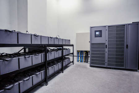 Room with many cables and many batteries. Backup power for larger buildings.の写真素材