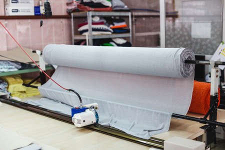 Machine for cutting a large fabrics. Machine cutter cutting clothの写真素材