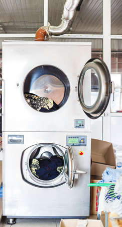Cleaning services with industrial laundry washing machine with cloth.の写真素材