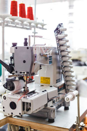 Close up of a professional typewriter for tailoring at a manufacturing plant. Textile: Industrial embroidery machine.の写真素材
