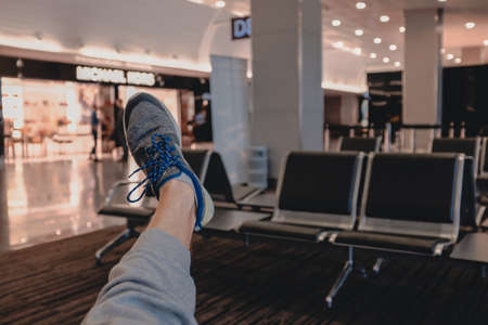 One leg in airport in waiting hallの写真素材