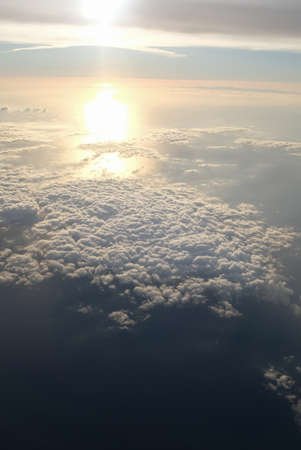 Sea landscape from the sky with white clouds on sunsetの写真素材