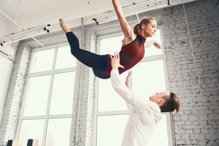 Couple of ballet dancers posing over urban background.の写真素材