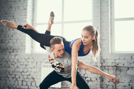 Sensual couple performing an artistic and emotional contemporary dance.