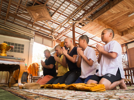 Yasothon, Thailand - 2/21/2015 : 5 Unidentified Asian young boys become a monk  on 2/21/2015 in Yasothon, Thailandのeditorial素材