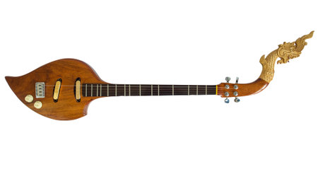 Thai musical instruments, Electric wooden pin with the great Naga head Isolated on white background. Clipping path.の写真素材