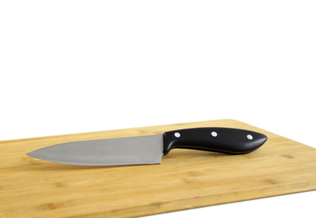 Kitchen knife on a wooden cutting board - Photo