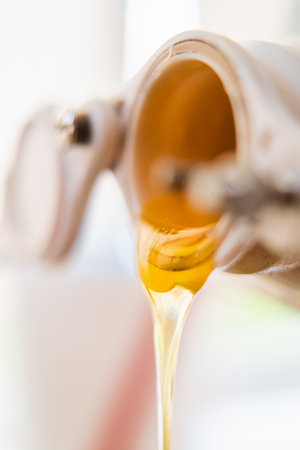 Freshly Extracted Viscouse Bee Honey Flowing Out Extreme Close Upの写真素材