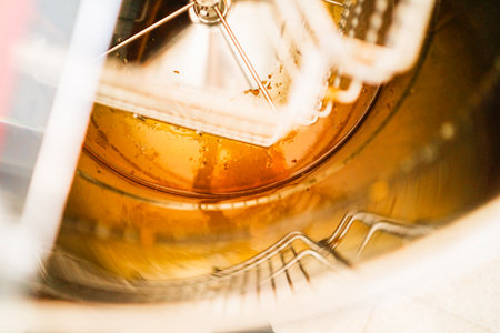 Golden Bee Honey Inside a Centrifucal Extractor During Beekeeping Harvestの写真素材