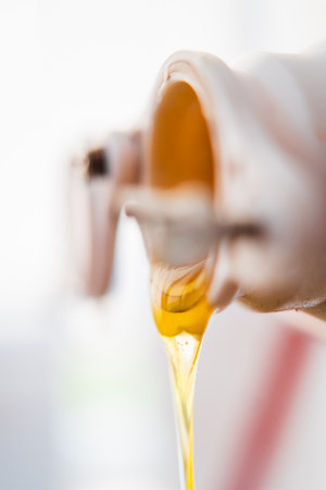 Viscouse Bee Honey Flowing Out Extreme Close Upの写真素材