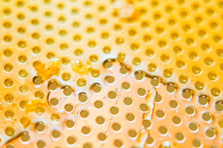 Viscouse Layer of Honey on a Metal Surface Close Upの写真素材