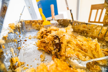 Beewax Collected in a Metal Decapping Tray After Bee Honey Harvestの写真素材