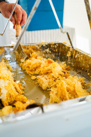 Beewax Collected in a Decapping Tray After Bee Honey Harvestの写真素材