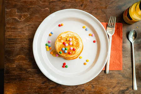Pancakes Topped with Chocolate Lentiles and Honey Top Down Viewの写真素材