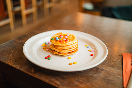 Stack of Soft Pancakes with Honey and Chocolate Lentile Toppingの写真素材