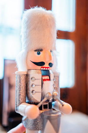 Nutcracker Doll With White Beard and Silver Coat Drumming the Drumsの写真素材