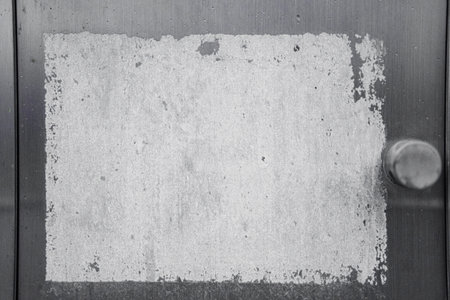 Metal Plate with Peeled off Sticker Textureの写真素材