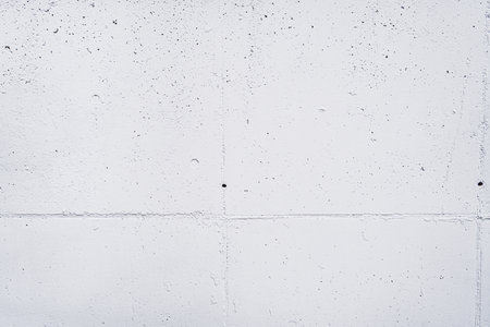 Weathered White Concrete Wall Texture with Columns Holes and Cracksの写真素材