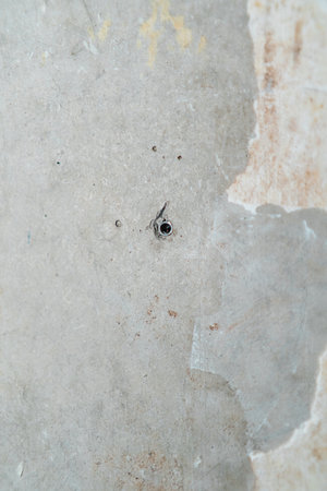 Raw Concrete and Plaster Construction Wall Texture with Screwの写真素材