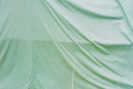 Weathered Green Fabric Cloth Texture with Wrinklesの写真素材