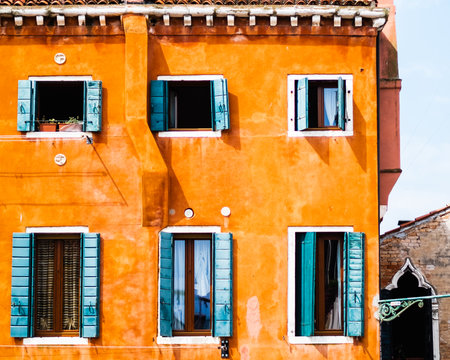 Mediterranean House With Plaster Wall Texture With Turquoise Window Shuttersの写真素材
