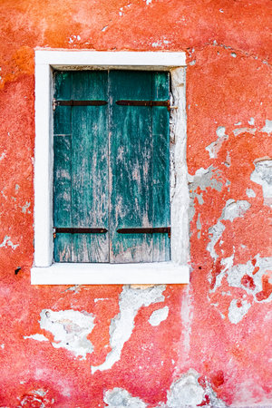 Weathered Red Plaster Wall With Wood Window Shutter for Textureing and Minimalismの写真素材