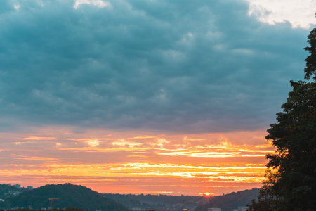 Sunrise With Colorful Skyline Filled with Cloudsの写真素材