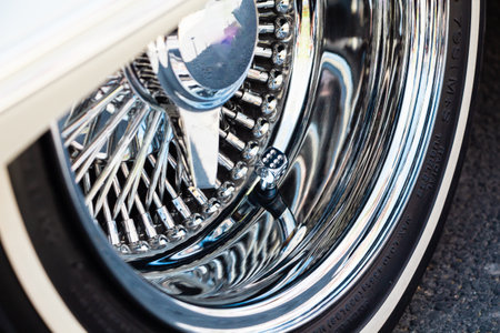 Wired Spoke Chrome Rim on White Stripe Wheel on a Low Rider Carの写真素材
