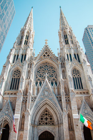 St Patrick's Cathedral with its white facade viewed from the front entrance in Manhattan New York Cityの写真素材