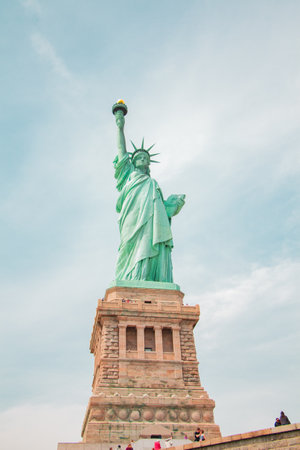 Statue of Liberty on its Base From the Front in a Vertical Full Shot with Sky in the Backgroundの写真素材