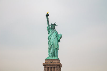 Statue of Liberty on its Base From the Front in a Wide Shot with Sky in the Backgroundの写真素材