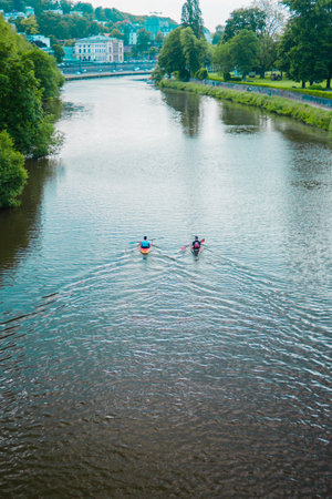 Kayaks Rowing on the River Stream Casuallyの写真素材