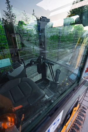 View in an Excavator Control Cabin with a Seat Control Stick Beds and Buttons to Control the Excavator Armの写真素材