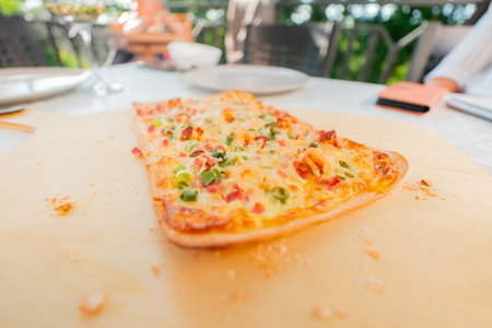 Delicious Fresh French Tarte Flambe Flammekueche Crust with CrÃ©me Fraiche Cheese Bacon Cubes and Spring Onionsの写真素材