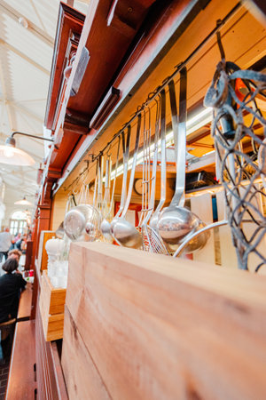 Kitchen Equipment with Tools Hanging from the Ceilingの写真素材